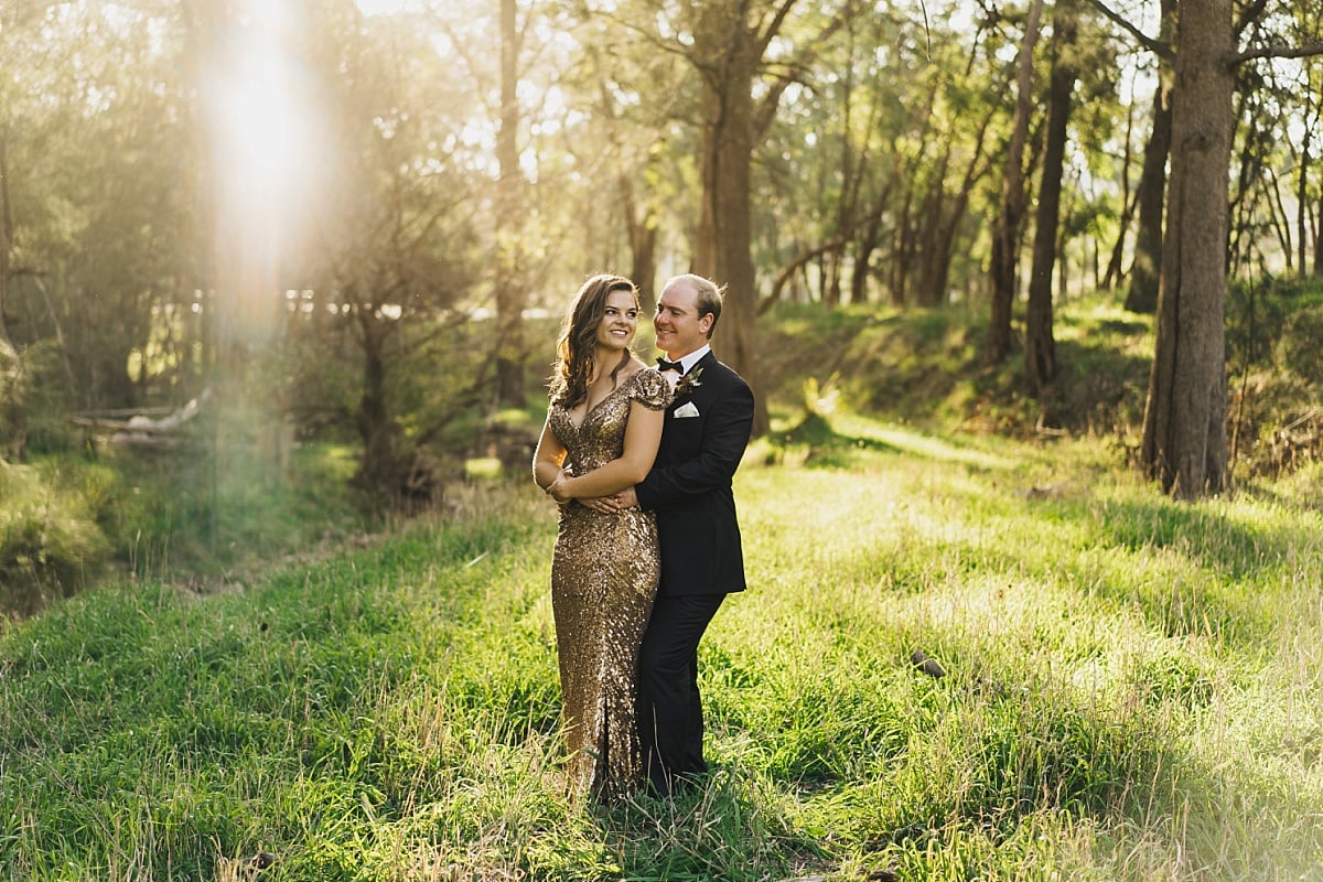 Bride and Groom photo in the bush with a sun flare